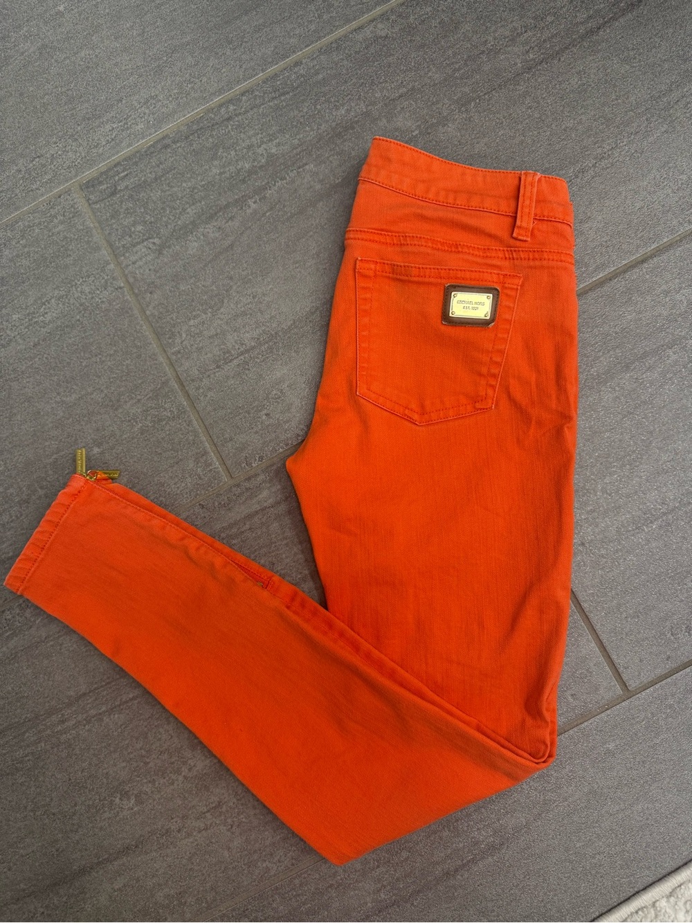 Michael Kors Bright Orange Skinny Jeans with Gold Plate